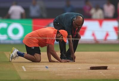 India captain Rohit Sharma inspects the pitch ahead of the World Cup semi-final against New Zealand at the Wankhede Stadium in Mumbai. Getty Images