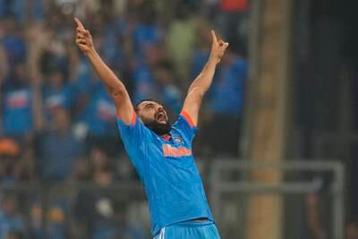 India's Mohammed Shami celebrates the wicket of New Zealand's Daryl Mitchell. AP