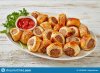 puff-pastry-sausage-rolls-tomato-sauce-parsley-white-plate-english-party-food-horizontal-view-...jpg