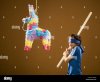 blindfolded-boy-with-stick-and-pinata-BJJX4P.jpg