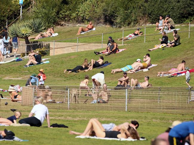 People lying in the sun at Bronte.jpeg