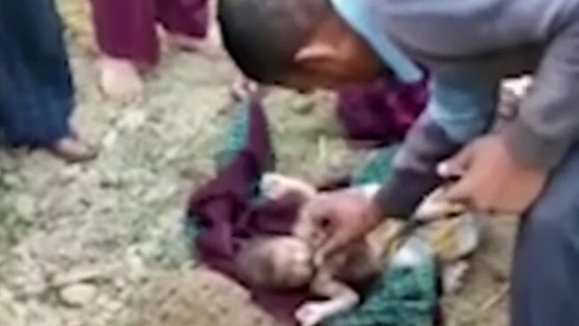 The newborn baby was miraculously found alive in shallow grave in northern India. Picture: SWNS/Mega