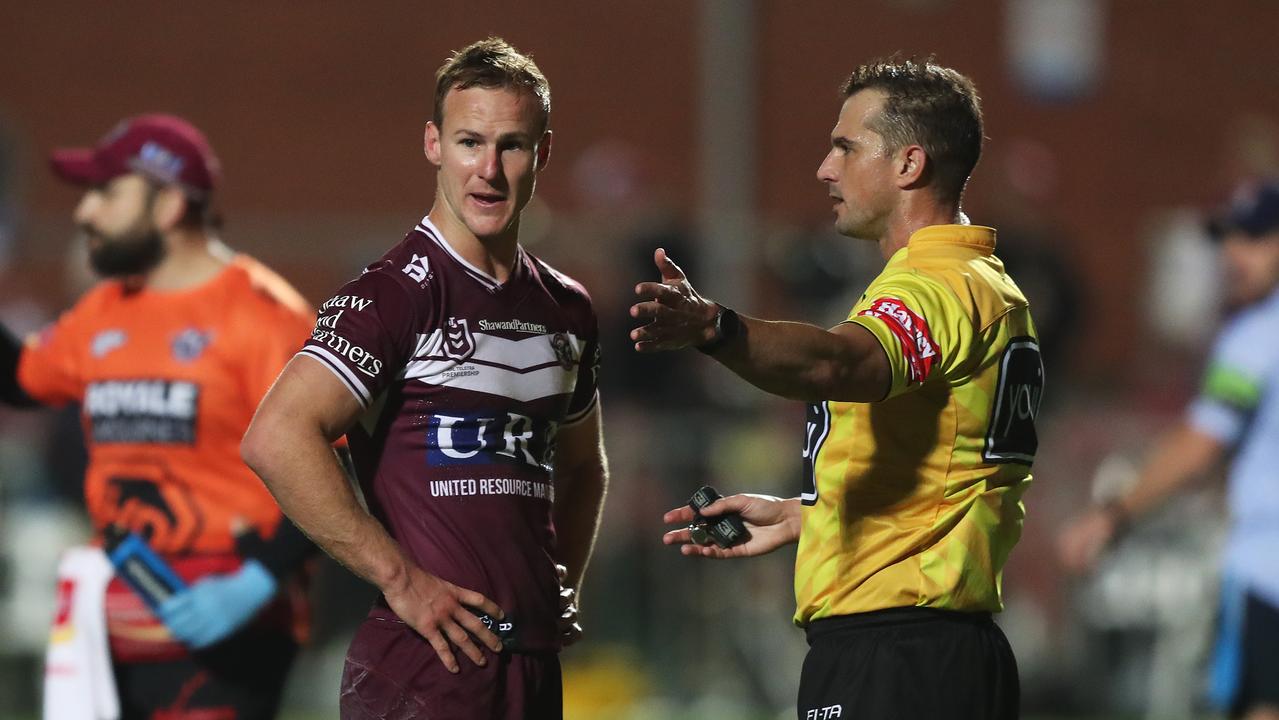 Manly's Daly Cherry-Evans with referee Grant Atkins.
