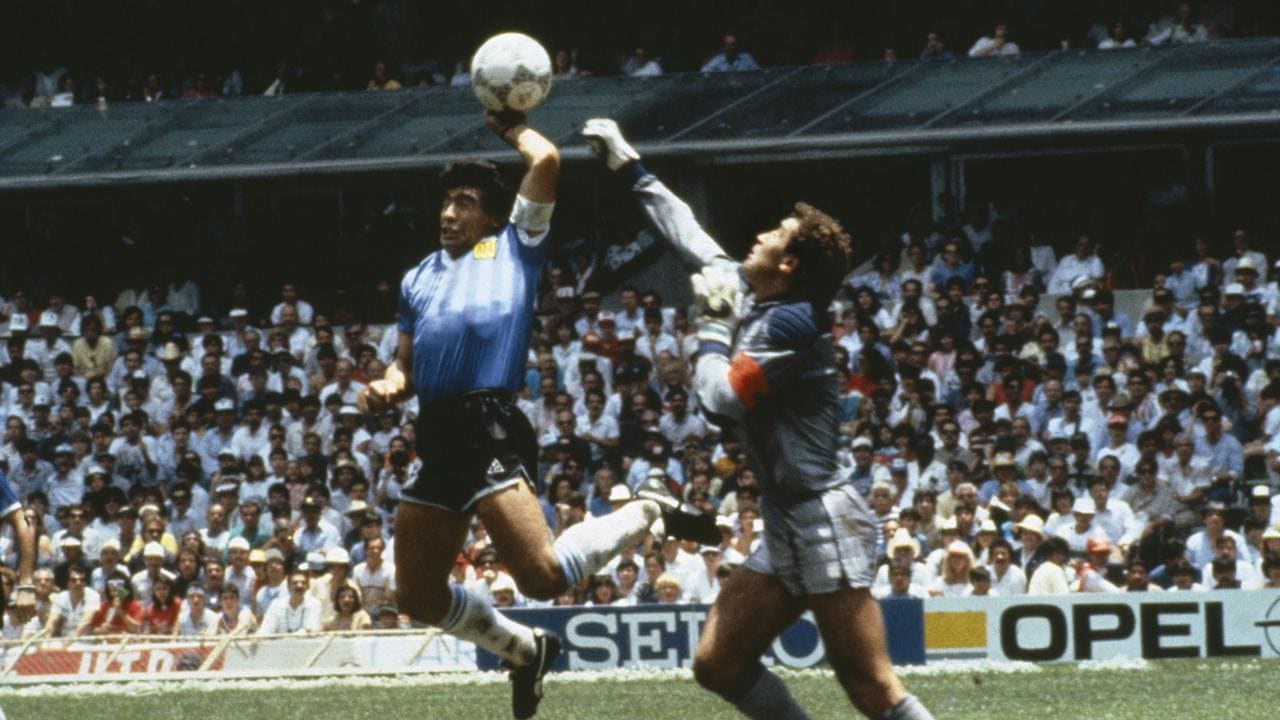 Diego Maradona scores 1st goal with his Hand of God, past England goalkeeper Peter Shilton (Photo by Bob Thomas/Getty Images)
