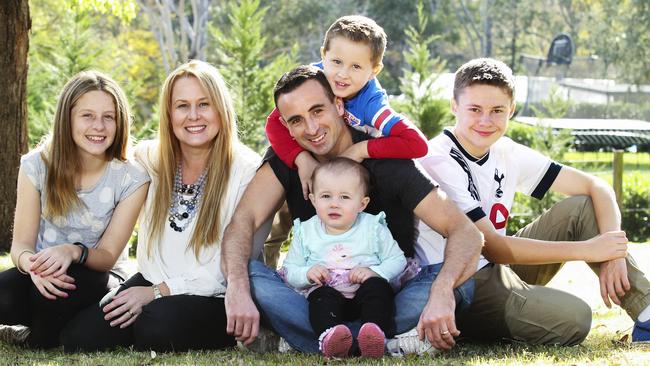State of Origin referee Gerard Sutton at home with wife Julie and children Jess, 13, Lawson, 4, Charlotte, 18 months, and Alex, 14. Picture: Justin Lloyd