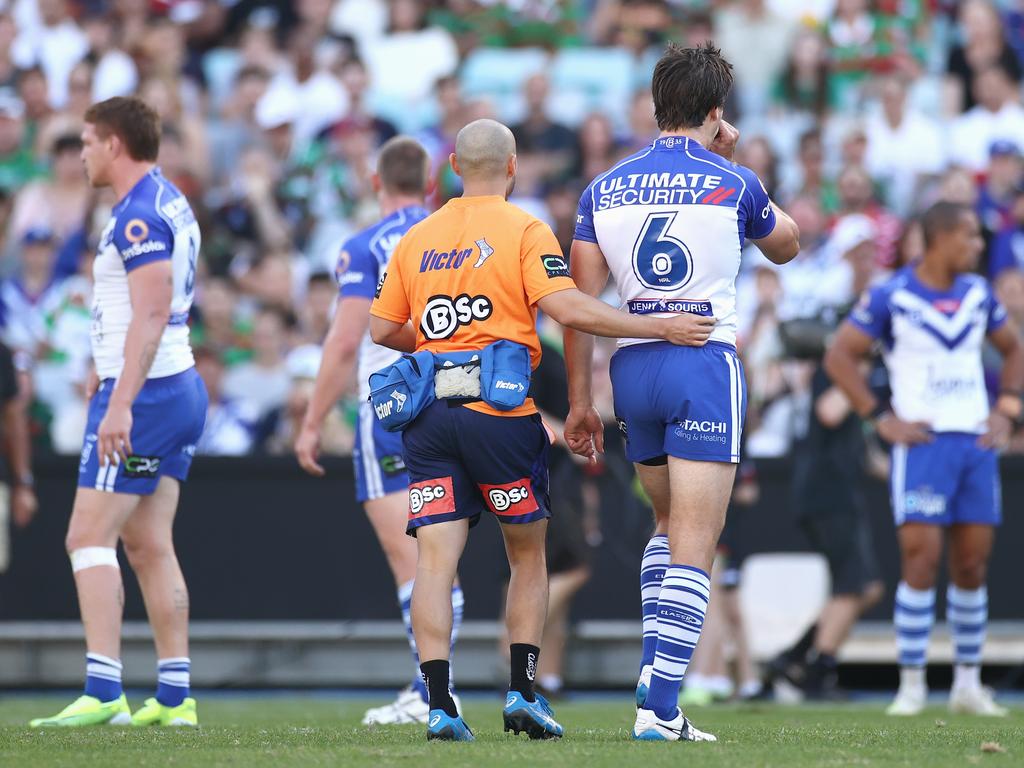 Lachlan Lewis of the Bulldogs leaves the field after a head knock. Picture: Cameron Spencer/Getty Images