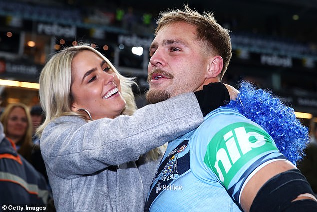 The NRL has stood down star player Jack de Belin (pictured with girlfriend Alyce Taylor after a 2018 State of Origin match) from playing while he waits to answer a sexual assault charge  