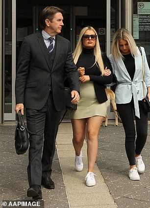 Robinson (centre) pictured leaving court on September 3