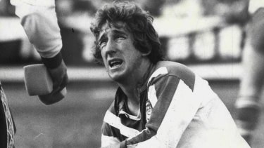 Steve Mortimer. playing for Canterbury in 1979, is attended to by a trainer.