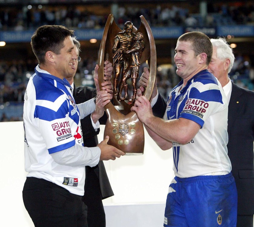 Steve Price and Andrew Ryan celebrate the 2004 grand final win